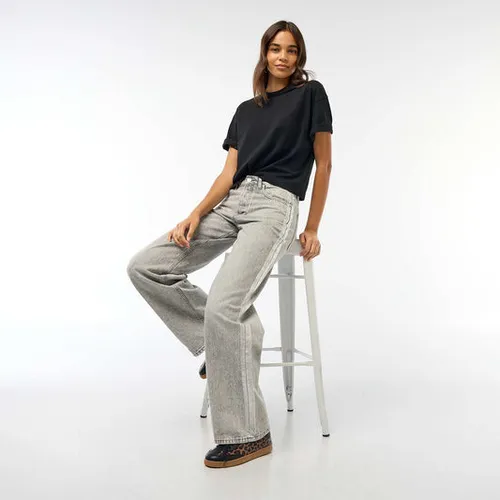 jean baggy avec bandes argentées gris