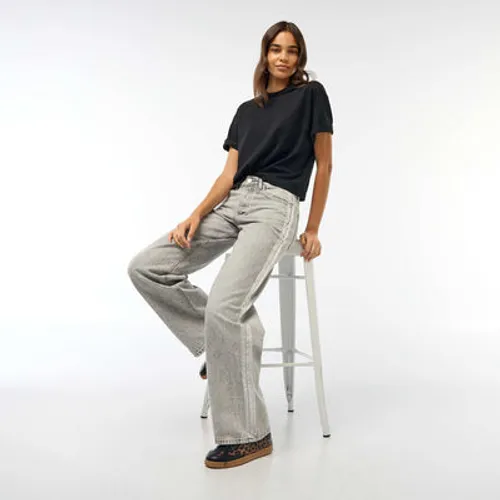 jean baggy avec bandes argentées gris