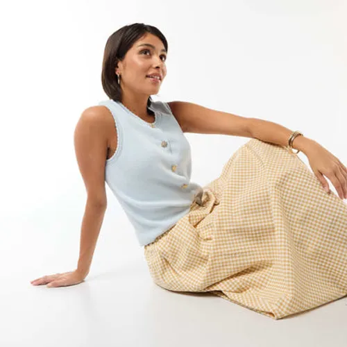top sans manches avec boutons dorés bleu